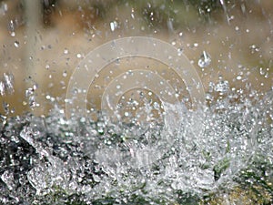 Drops of water sprouting from fountain.