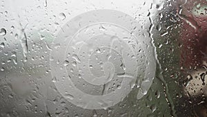 Drops of water on the window glass during heavy rain.