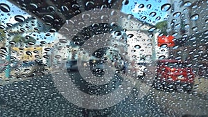 Drops of water on the windshield of a car