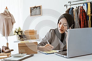 Dropshipping business owner working in her office