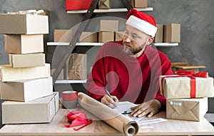 The dropshipping business owner works before christmas and new year checks the order for confirmation before shipping to