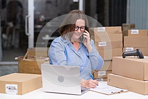 dropshipping business woman with table laptop, shipping boxes, retail marketplace for online sales