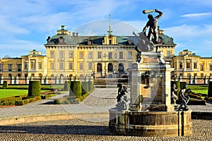 Drottningholm Palace with fountain in the picturesque gardens, Stockholm, Sweden