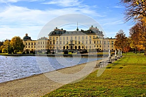 Drottningholm Palace, Sweden`s royal residence with lake during autumn