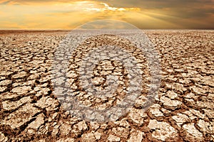 Drought land and cracked earth in sunrise with climate change an