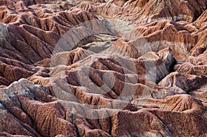 Drought red orange sand stone rock formation in