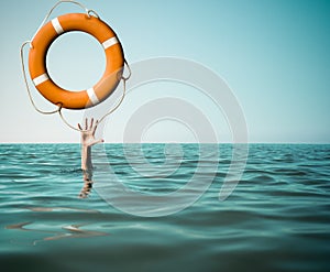 Drown man with rised hand getting lifebuoy help in sea