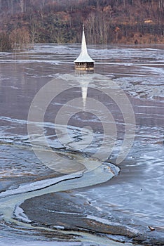 Drowned church at Geamana lake near gold mine