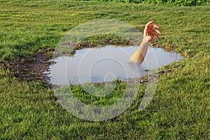 drowning arm in puddle