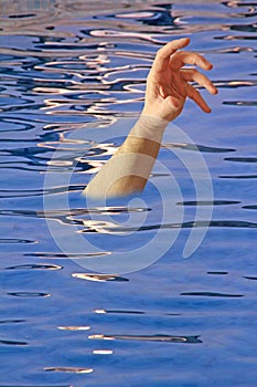 Drowning arm in swimming pool