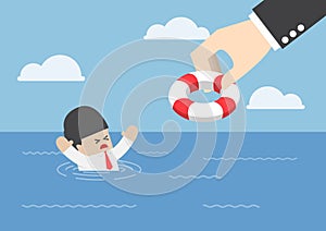 Drowning businessman getting lifebuoy from big hand