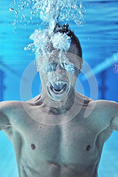 Drowning man underwater diver