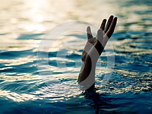 Drowning victims, Hand of drowning man needing help.