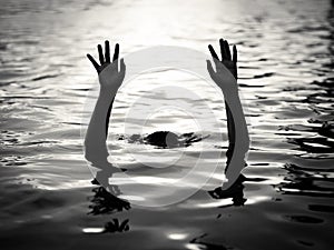 Drowning victims, Hand of drowning man needing help.