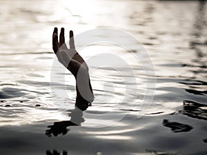 Drowning victims, Hand of drowning man needing help. Failure and