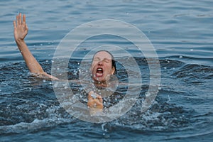Drowning woman reaching for help