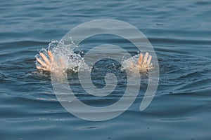 Drowning woman reaching for help in sea, closeup