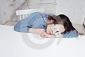 Drowsiness and procrastination. A student pretends to work,