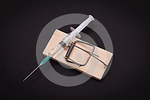 Drug Addict or Heroin Hazard - Syringe with Drug Dose in Mousetrap