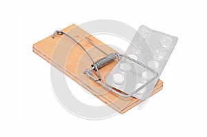 Drug addiction concept - mouse trap and tablet