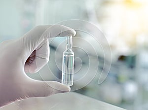 Drug ampule in workers hand