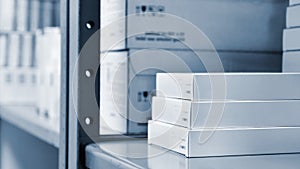 Drug boxes in a shelf in a pharmacy. Store of medicines and vitamins. Background for sale in a pharmacy and health lifestyle.