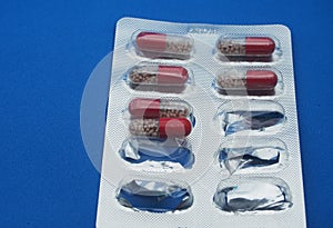 The drug in capsules. Capsules lie in plastic transparent packaging