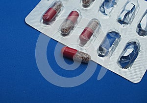 The drug in capsules. Capsules lie in plastic transparent packaging