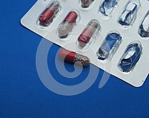 The drug in capsules. Capsules lie in plastic transparent packaging