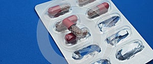 The drug in capsules. Capsules lie in plastic transparent packaging