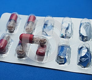 The drug in capsules. Capsules lie in plastic transparent packaging