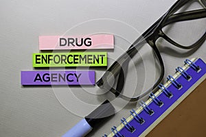 Drug Enforcement Agency - DEA text on sticky notes  on office desk