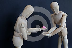 drug pill dealing taking series with wooden manikin figures