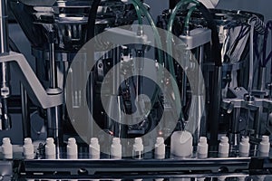 Drug Production. Medical vials on pharmaceutical manufacturing line. Medical ampoules on automated production line at