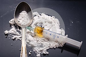 Drug syringe and cooked heroin