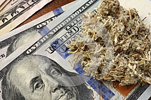 Drug trading concept. Weed and dollars.