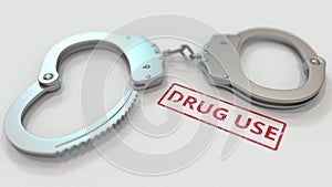 DRUG USE stamp and handcuffs. Crime and punishment related conceptual 3D rendering