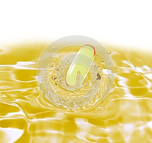 Drug yellow capsule fish oil omega3 droping in oil water on whi photo