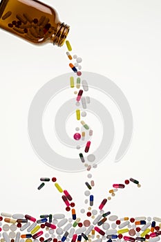 Drugs Pouring from a Medicine Bottle photo