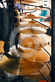Drum cymbals on showcase in music store, nobody