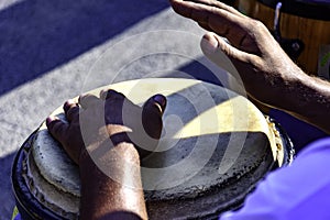 Drum player playing atabaque