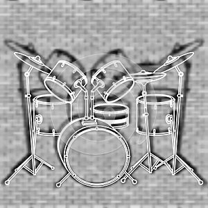 Drum set against the backdrop of a brick wall