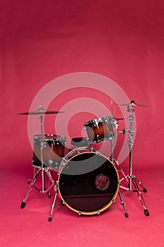 Drum set on a red background