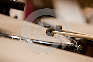 Drum sticks hitting the timpani