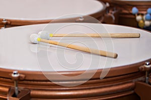 Drum sticks lying on the timpani