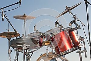 Drumkit against a blue sky background photo