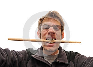 Drummer biting his drumstick