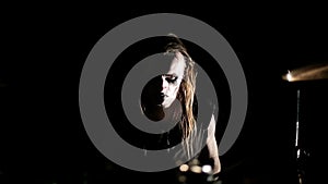 Drummer of black metal band. Close up dark background