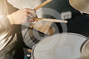 Drummer hands playing snare drum with drumsticks, Close-up