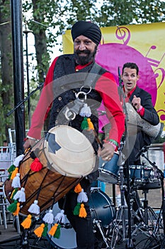 Drummer Jonny Kalsi from the Dhol Foundation playing at an annual concert of Jewish Klezmer music in Regent`s Park in London UK.